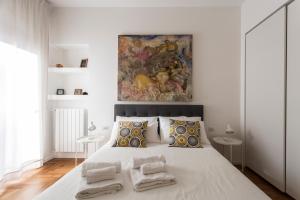 Un pat sau paturi într-o cameră la Dimora Toledo