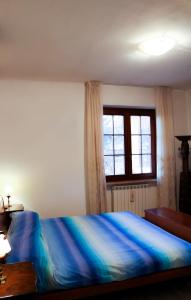 En eller flere senge i et værelse på Villa La Perla