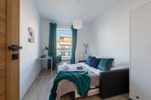 Posteľ alebo postele v izbe v ubytovaní P&O Apartments Służewiec