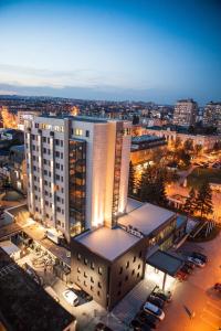 an overhead view of a building in a city at night at Hotel Kragujevac in Kragujevac