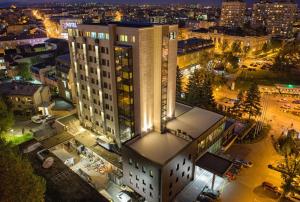 an overhead view of a building in a city at night at Hotel Kragujevac in Kragujevac