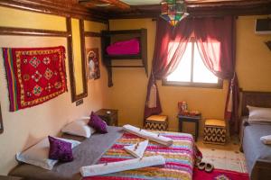 Voodi või voodid majutusasutuse Riad Atlas Panorama toas