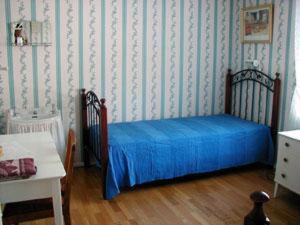 Säng eller sängar i ett rum på Berggårdens Gästgiveri