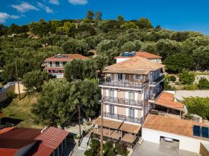 an aerial view of a building with a hill in the background at Bratis Apartments in Keri