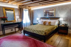 Postel nebo postele na pokoji v ubytování EGO' Residence Venice
