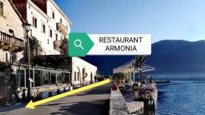 a sign that readsresistant amazonarma next to a building at Apartment Mediterraneo Blue Sky in Perast