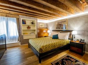 Postel nebo postele na pokoji v ubytování EGO' Residence Venice