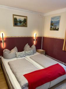 Säng eller sängar i ett rum på Gasthaus Luggwirt