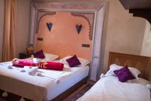 Voodi või voodid majutusasutuse Riad Atlas Panorama toas