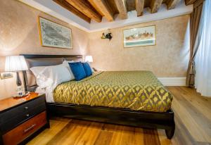 Postel nebo postele na pokoji v ubytování EGO' Residence Venice