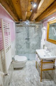 a bathroom with a sink and a shower and a toilet at EGO' Residence Venice in Venice