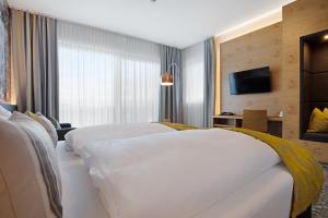 Voodi või voodid majutusasutuse Hotel Hausschachen toas