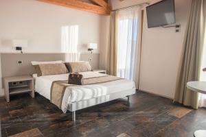 Postel nebo postele na pokoji v ubytování Casanova Inn + 16 fotografií