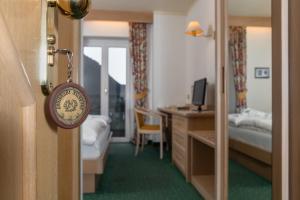 Voodi või voodid majutusasutuse Albergo Contrin toas