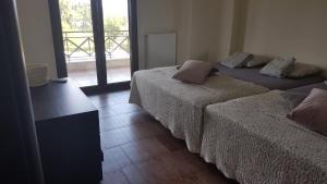 Postel nebo postele na pokoji v ubytování Kriopigi Paradise