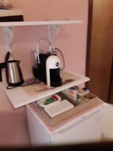 Příslušenství pro přípravu čaje a kávy v ubytování Capalbio Vacanze