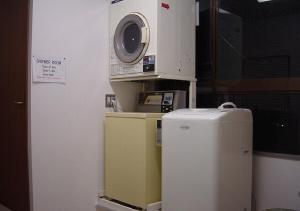 a kitchen with a microwave and a small refrigerator at kawagutiko station inn / Vacation STAY 63732 in Azagawa