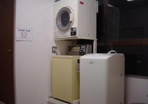 a kitchen with a microwave and a small refrigerator at kawagutiko station inn / Vacation STAY 63722 in Azagawa