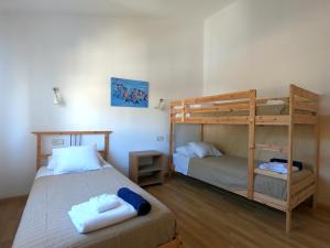 a bedroom with two beds and a bunk bed at Son Veri D'Abaix in El Arenal