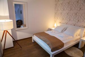Postel nebo postele na pokoji v ubytování Garni Hotel Vila Drina