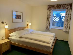 Postel nebo postele na pokoji v ubytování Haus Bergwelt - Appartements