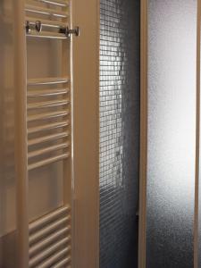 a sliding glass door to a closet with a shower at Romantic Holiday Rome B&B in Rome