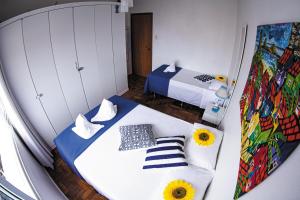 A bed or beds in a room at Apartamento de Férias Copacabana Rio de Janeiro