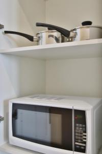 Kuchyň nebo kuchyňský kout v ubytování Domi Serviced Apartments