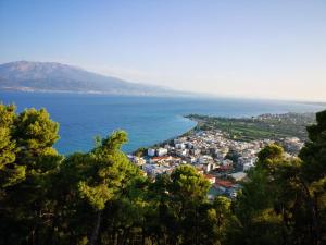 a view of a city and the ocean at Angelland Luxury Suites in Nafpaktos