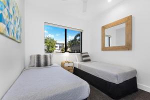Voodi või voodid majutusasutuse Mirra Chana Beachfront Apartments Mooloolaba toas