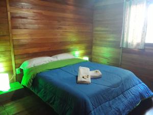 Una cama o camas en una habitación de La Lucinda - Campo y mar
