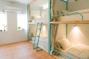 a room with bunk beds in a hostel at Nextdoor Patan in Pātan