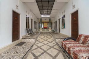 RedDoorz Syariah @ Mora Garden Bungo的休息区
