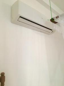 a light hanging from a ceiling in a room at Vivid Lanka in Bentota