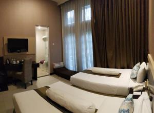 TV a/nebo společenská místnost v ubytování Vio Hotel Cimanuk Bandung + 21 fotografií