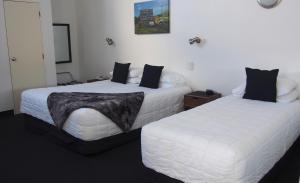 Postel nebo postele na pokoji v ubytování Totara Lodge