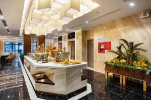 a hotel lobby with a counter with fruit on it at VENTANA NHA TRANG HOTEL in Nha Trang