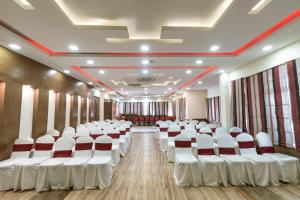 a room with rows of white chairs in it at Hotel Manang in Kathmandu