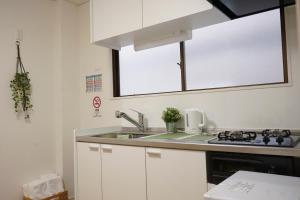 ZAITO Tokyo Kikukawa Economy Inn 宅东东京菊川民宿廚房或簡易廚房