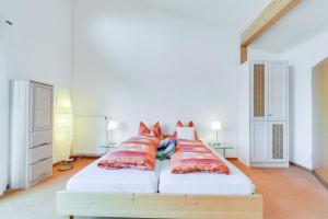 Giường trong phòng chung tại Muc City de Lux 120 qm