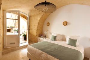 Ένα ή περισσότερα κρεβάτια σε δωμάτιο στο Le Vieux Castillon