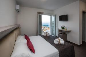 Postel nebo postele na pokoji v ubytování Spuma di mare