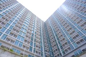 two tall apartment buildings with balconies at Tiba at Jatinangor Hotel in Cikeruh