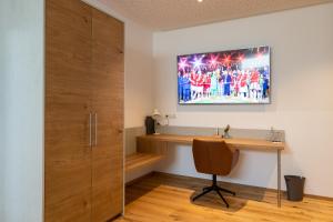 TV a/nebo společenská místnost v ubytování Aparthotel nah dran