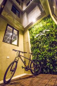 a bike is parked next to a building at Central Woods in Yilan City