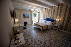 Voodi või voodid majutusasutuse Sui Generis Tropea Luxury Rooms toas