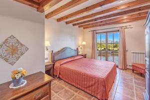 Ένα ή περισσότερα κρεβάτια σε δωμάτιο στο Es Coster de Na Llusia