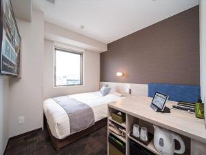 Postel nebo postele na pokoji v ubytování Super Hotel Premier Saitama Higashiguchi + 37 fotografií