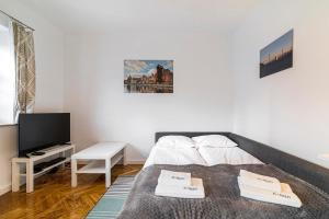 Televízia a/alebo spoločenská miestnosť v ubytovaní Four Lions - BillBerry Apartments