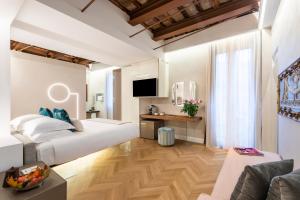 Posteľ alebo postele v izbe v ubytovaní Poēsis Experience Hotel